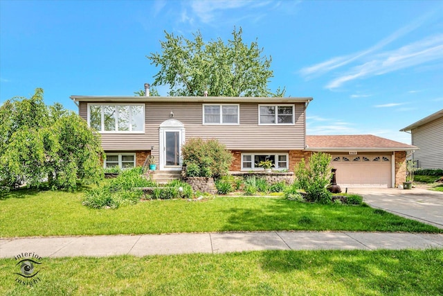 7707 Bristol Ln, Tinley Park, IL 60477 - bi-level home with a garage, driveway, a front yard, and brick siding