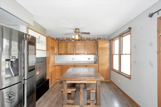7707 Bristol Ln, Tinley Park, IL 60477 - kitchen with stainless steel refrigerator with ice dispenser, light wood-style floors, ceiling fan, light countertops, and baseboards