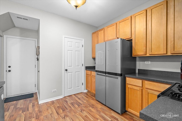 616 Springbrook Trl N, Oswego, IL 60543 - kitchen featuring freestanding refrigerator, wood finished floors, dark countertops, baseboards, and range