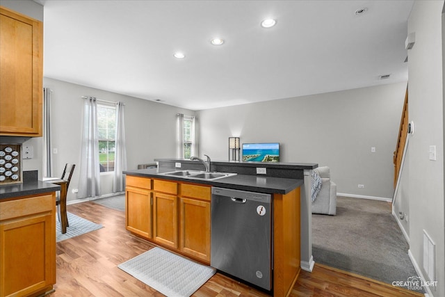 616 Springbrook Trl N, Oswego, IL 60543 - kitchen featuring stainless steel dishwasher, a sink, open floor plan, a center island with sink, and dark countertops
