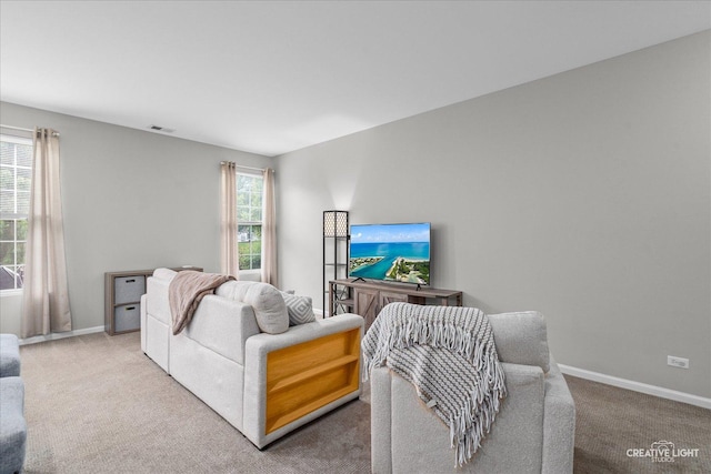 616 Springbrook Trl N, Oswego, IL 60543 - carpeted living room with healthy amount of natural light and baseboards
