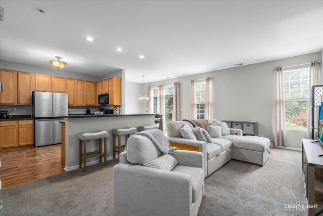 616 Springbrook Trl N, Oswego, IL 60543 - living area featuring healthy amount of natural light, carpet flooring, recessed lighting, and baseboards