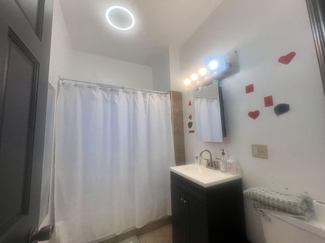 3945 W Augusta Blvd, Chicago, IL 60651 - full bathroom with vanity, a shower with shower curtain, and tile patterned flooring
