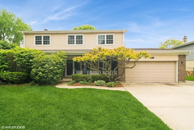 1921 E Peachtree Ln, Arlington Heights, IL 60004 - traditional-style house featuring an attached garage, concrete driveway, a front yard, and brick siding