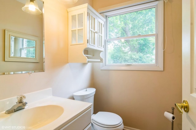 1921 E Peachtree Ln, Arlington Heights, IL 60004 - half bathroom with toilet, healthy amount of natural light, and vanity