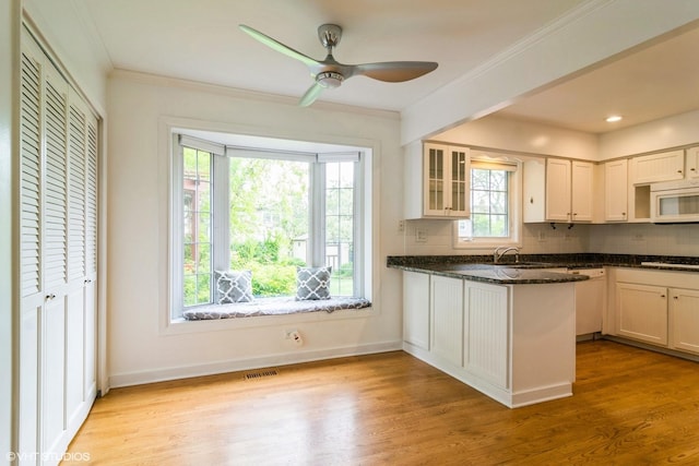 1921 E Peachtree Ln, Arlington Heights, IL 60004 - kitchen with white appliances, backsplash, light wood-style flooring, glass insert cabinets, and baseboards