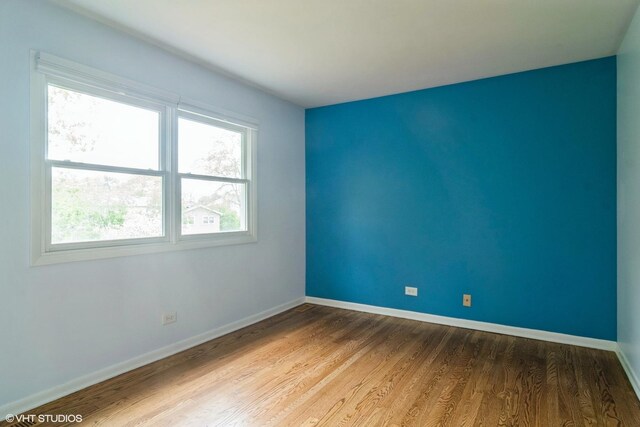 1921 E Peachtree Ln, Arlington Heights, IL 60004 - empty room featuring wood finished floors and baseboards