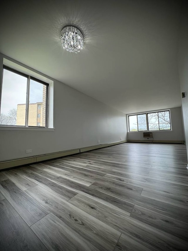 9720 S Pulaski Rd Unit 306, Oak Lawn, IL 60453 - empty room with a chandelier, wood finished floors, and baseboards
