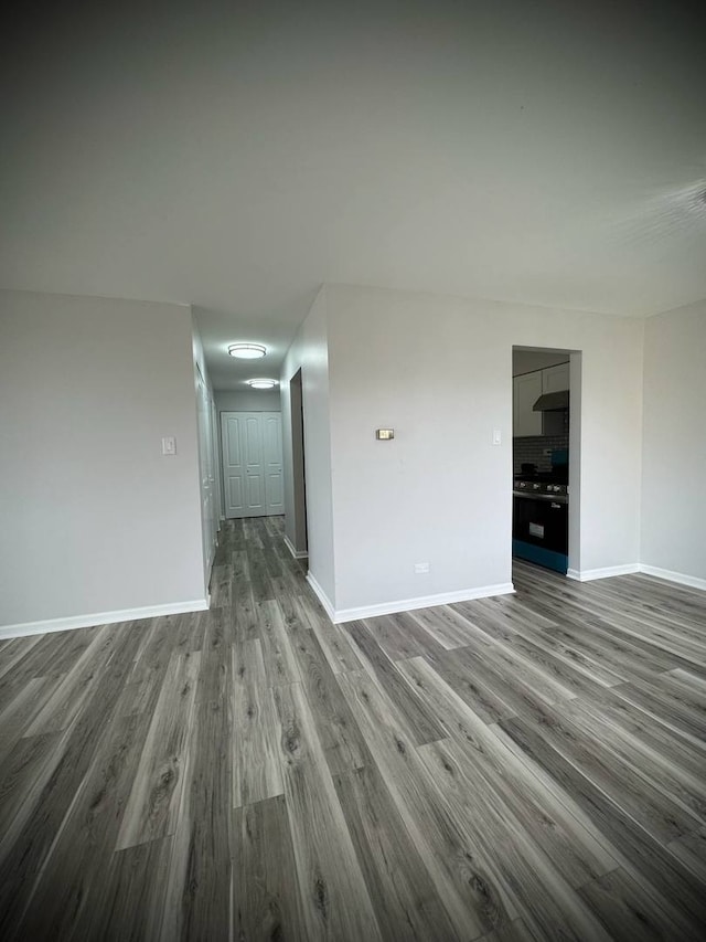 9720 S Pulaski Rd Unit 306, Oak Lawn, IL 60453 - empty room featuring dark wood-type flooring and baseboards