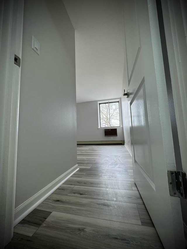 9720 S Pulaski Rd Unit 306, Oak Lawn, IL 60453 - hallway with baseboards, wood finished floors, and an AC wall unit