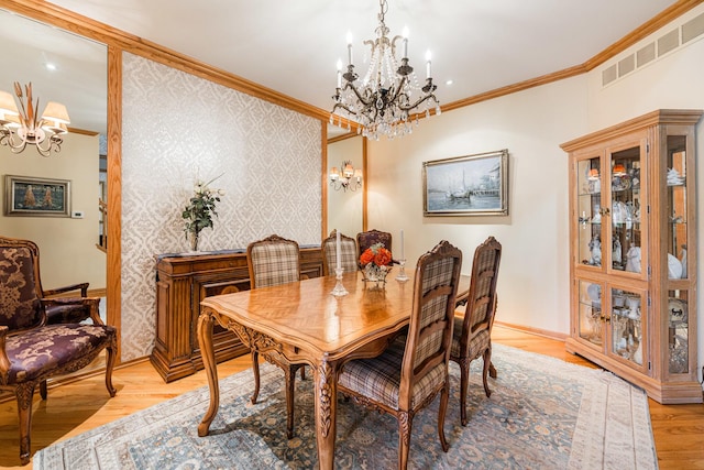 1607 Park Point, Ridge Point, Park Ridge, IL 60068 - dining room featuring a chandelier, ornamental molding, baseboards, and light wood finished floors