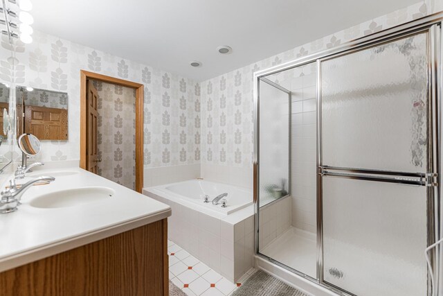 1607 Park Point, Ridge Point, Park Ridge, IL 60068 - bathroom featuring a bath, a stall shower, double vanity, and wallpapered walls