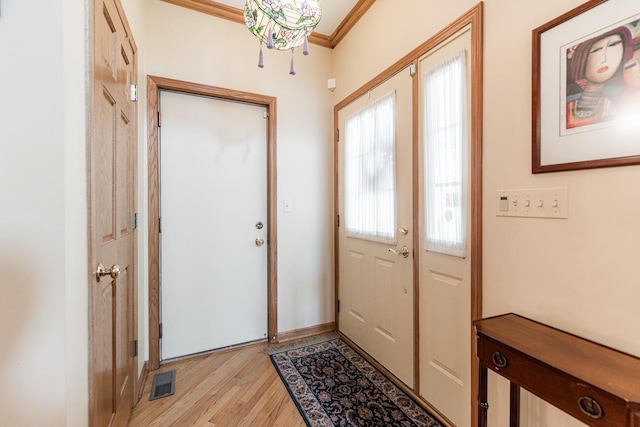 1607 Park Point, Ridge Point, Park Ridge, IL 60068 - doorway with light wood-style floors, crown molding, and baseboards