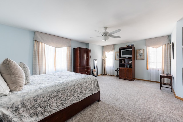 1607 Park Point, Ridge Point, Park Ridge, IL 60068 - bedroom featuring multiple windows, light colored carpet, baseboards, and ceiling fan