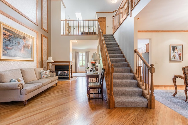 1607 Park Point, Ridge Point, Park Ridge, IL 60068 - living area featuring stairway, wood finished floors, ornamental molding, baseboards, and a fireplace