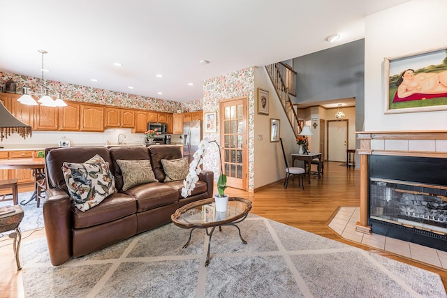1607 Park Point, Ridge Point, Park Ridge, IL 60068 - living area with light wood-type flooring, wallpapered walls, a tiled fireplace, baseboards, and recessed lighting