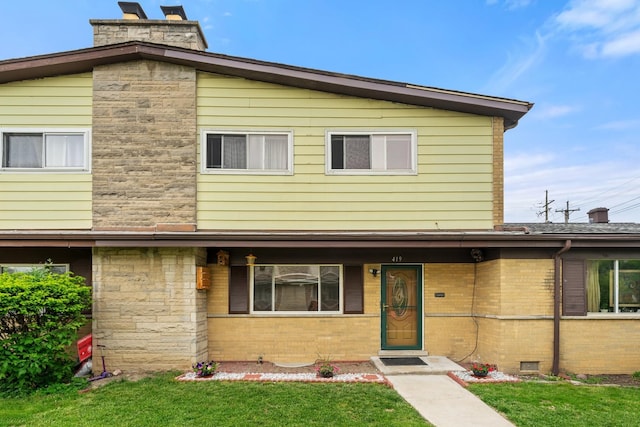419 Glenshire Rd, Glenview, IL 60025 - view of front facade with a chimney, a front lawn, and brick siding