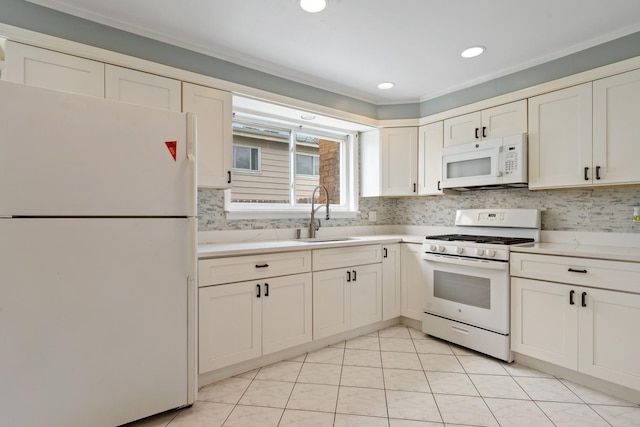 419 Glenshire Rd, Glenview, IL 60025 - kitchen with white appliances, a sink, light countertops, backsplash, and recessed lighting