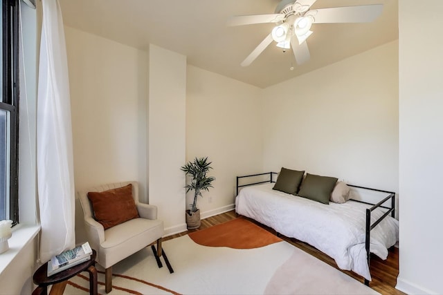 1954 W George St Unit 2, Chicago, IL 60657 - bedroom featuring wood finished floors, a ceiling fan, and baseboards