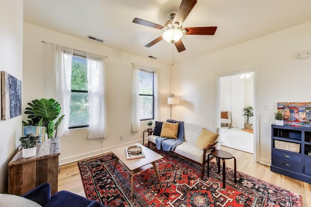 1954 W George St Unit 2, Chicago, IL 60657 - living room featuring light wood-style flooring, ceiling fan, and baseboards