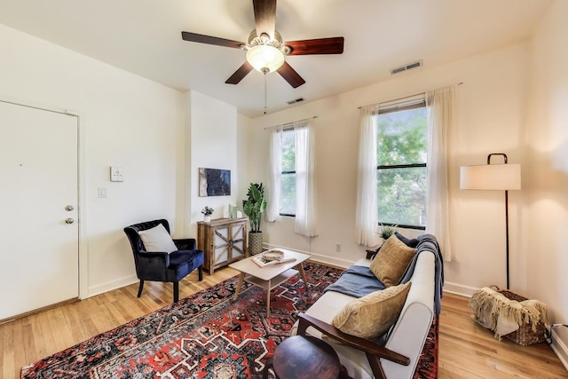 1954 W George St Unit 2, Chicago, IL 60657 - living area with light wood finished floors, a ceiling fan, and baseboards