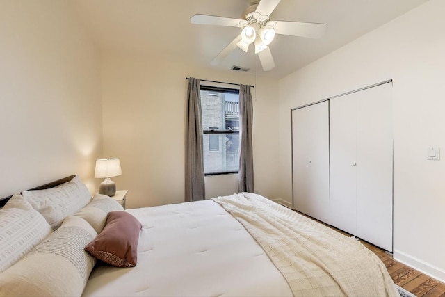 1954 W George St Unit 2, Chicago, IL 60657 - bedroom featuring wood finished floors, a ceiling fan, a closet, and baseboards