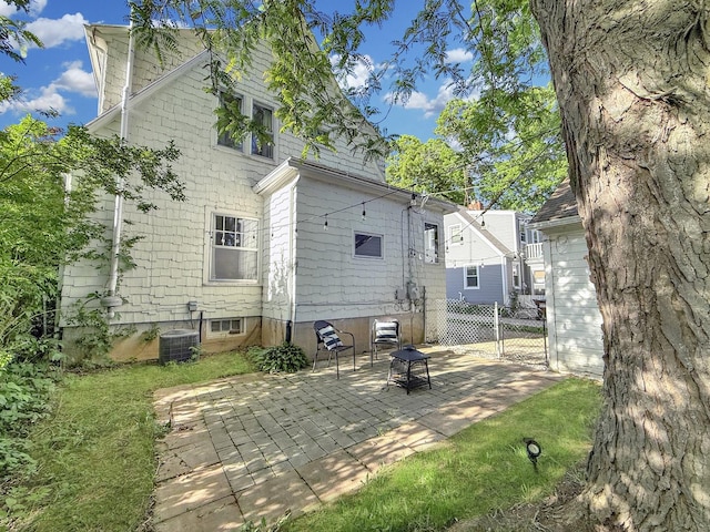 1351 W Stover St, Freeport, IL 61032 - back of house featuring a patio