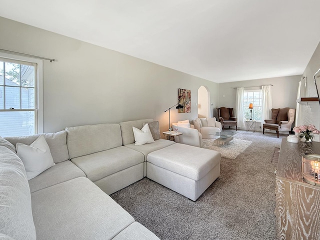 1351 W Stover St, Freeport, IL 61032 - carpeted living area with arched walkways and plenty of natural light