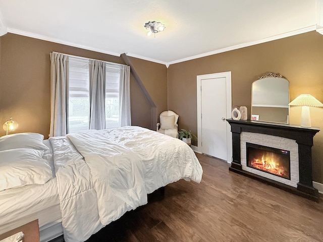 1351 W Stover St, Freeport, IL 61032 - bedroom featuring crown molding, wood finished floors, and a fireplace