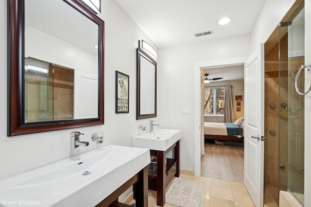 4150 N Kenmore Ave Unit 206, Chicago, IL 60613 - ensuite bathroom with a stall shower, two vanities, ceiling fan, and recessed lighting
