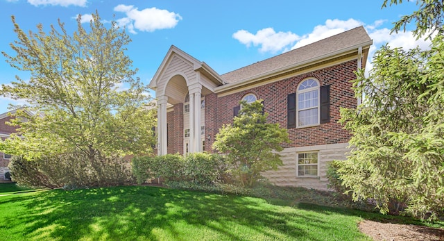 679 Prestwick Ln, Wheeling, IL 60090 - view of front facade featuring brick siding and a front lawn