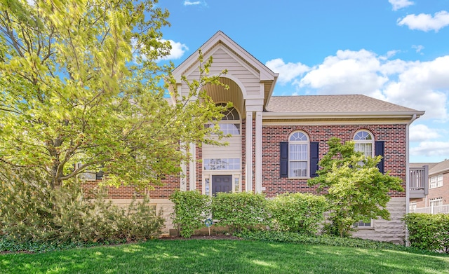 679 Prestwick Ln, Wheeling, IL 60090 - view of front facade featuring brick siding, a front yard, and a shingled roof