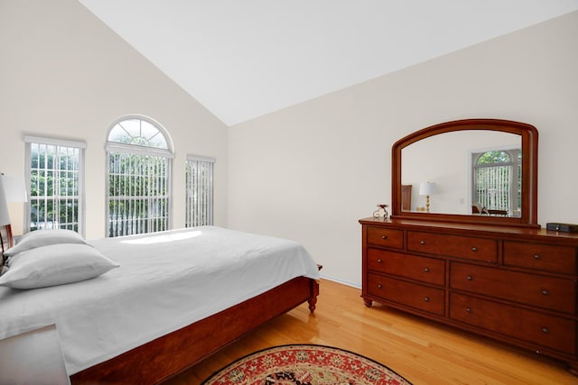 679 Prestwick Ln, Wheeling, IL 60090 - bedroom featuring light wood-style flooring, high vaulted ceiling, and multiple windows