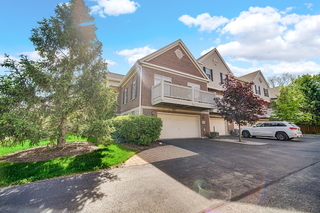 679 Prestwick Ln, Wheeling, IL 60090 - multi unit property with brick siding, asphalt driveway, and a garage