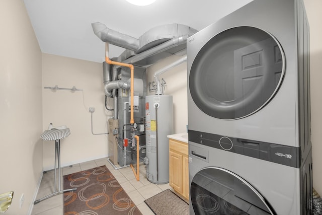 679 Prestwick Ln, Wheeling, IL 60090 - washroom with estacked washer and dryer, water heater, cabinet space, light tile patterned floors, and heating unit
