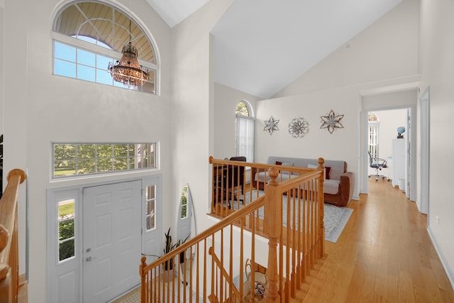 679 Prestwick Ln, Wheeling, IL 60090 - entryway featuring high vaulted ceiling, light wood-style floors, plenty of natural light, and a chandelier