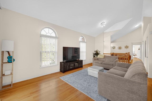679 Prestwick Ln, Wheeling, IL 60090 - living area featuring wood finished floors, vaulted ceiling, and baseboards