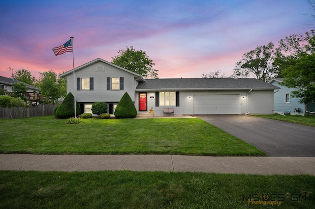 175 N Dogwood St, Cortland, IL 60112 - tri-level home featuring asphalt driveway and a garage