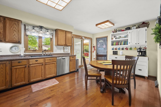 175 N Dogwood St, Cortland, IL 60112 - kitchen with stainless steel dishwasher, a sink, dark countertops, and open shelves