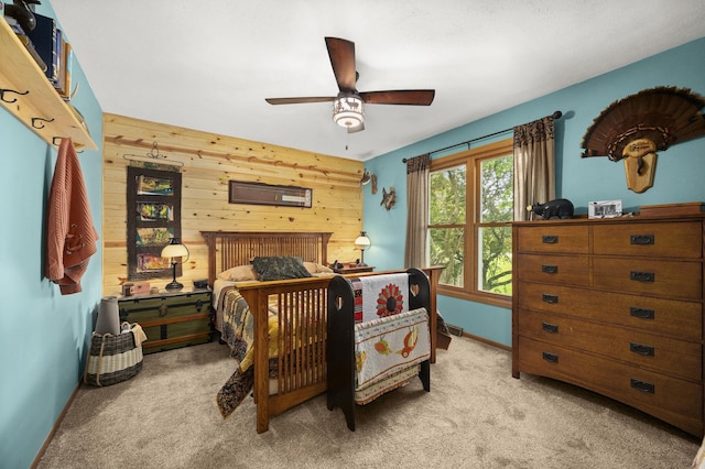175 N Dogwood St, Cortland, IL 60112 - carpeted bedroom featuring wooden walls, baseboards, and a ceiling fan