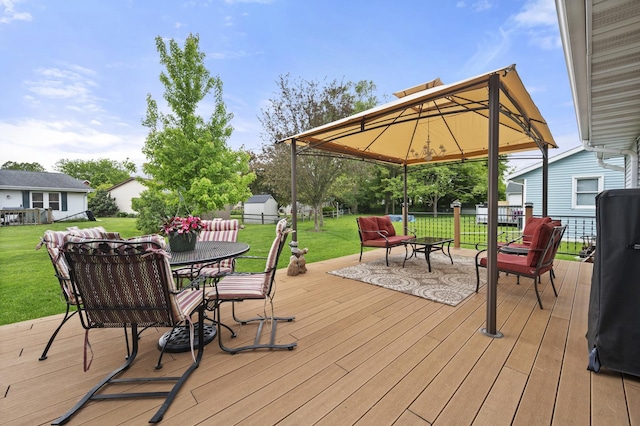 175 N Dogwood St, Cortland, IL 60112 - wooden deck featuring outdoor dining area, a lawn, and a gazebo