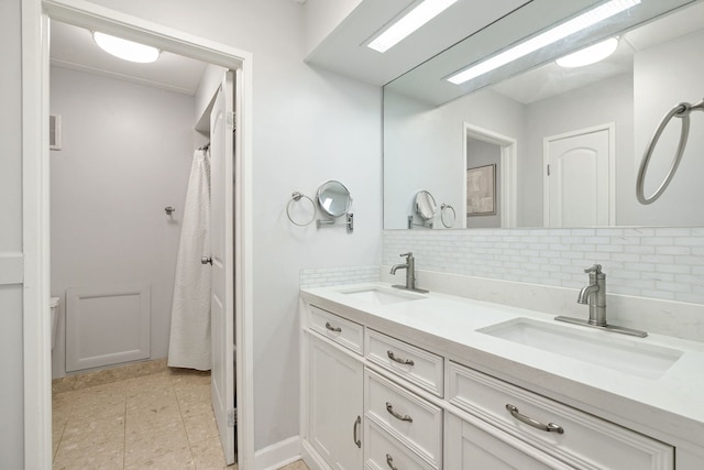 9737 N Fox Glen Dr Unit 5C, Niles, IL 60714 - bathroom with decorative backsplash, double vanity, and tile patterned flooring