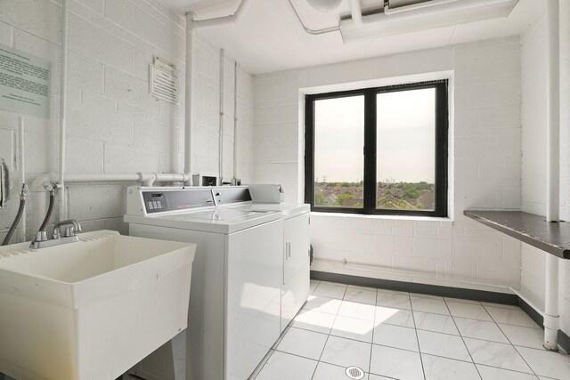 9737 N Fox Glen Dr Unit 5C, Niles, IL 60714 - shared laundry room with washing machine and dryer and concrete block wall