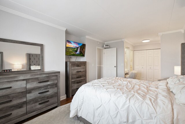 9737 N Fox Glen Dr Unit 5C, Niles, IL 60714 - bedroom with crown molding, dark wood finished floors, and a closet