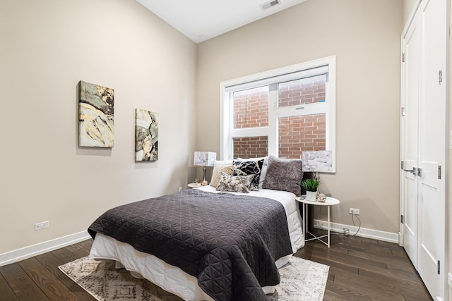 1513 W Walton St Unit 3, Chicago, IL 60642 - bedroom with baseboards and dark wood-type flooring