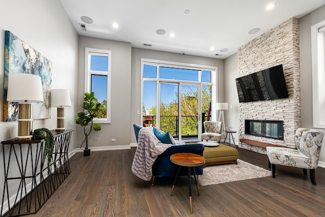 1513 W Walton St Unit 3, Chicago, IL 60642 - living room with wood finished floors, a stone fireplace, baseboards, and recessed lighting