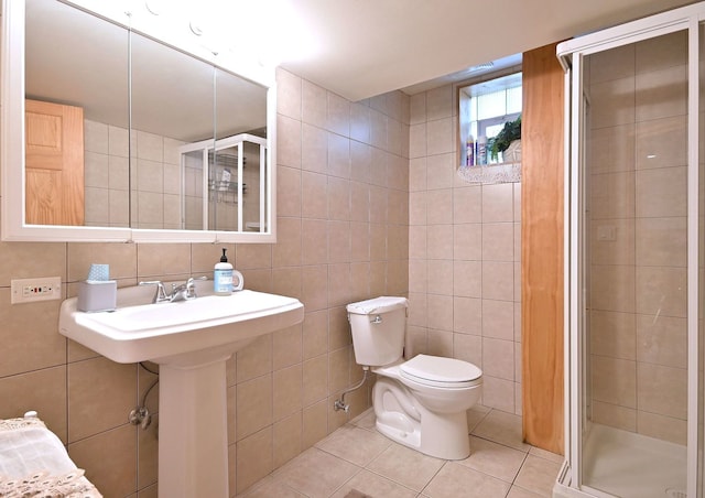 7513 W Isham Ave, Chicago, IL 60631 - bathroom with tile walls, tile patterned flooring, a stall shower, and toilet