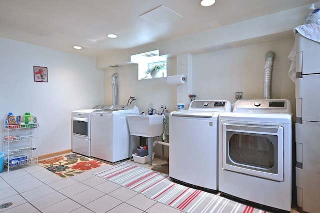 7513 W Isham Ave, Chicago, IL 60631 - laundry room with washing machine and clothes dryer, recessed lighting, light tile patterned floors, and baseboards