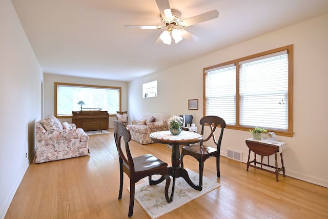 7513 W Isham Ave, Chicago, IL 60631 - dining space with a ceiling fan, light wood finished floors, and baseboards
