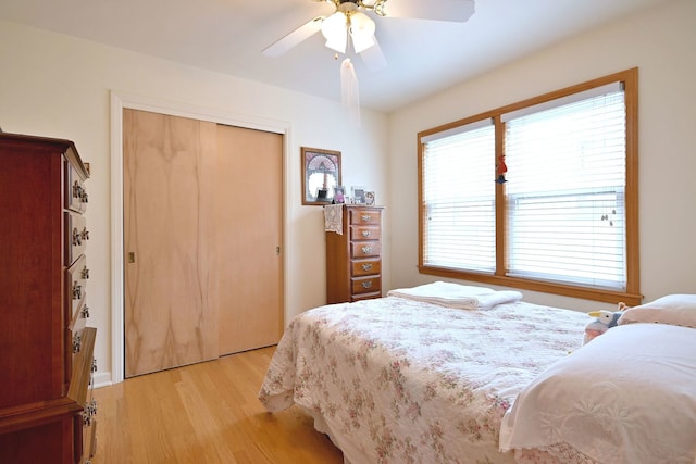 7513 W Isham Ave, Chicago, IL 60631 - bedroom featuring light wood-style flooring, a closet, and a ceiling fan